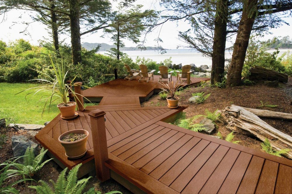 Composite deck with chairs overlooking water.