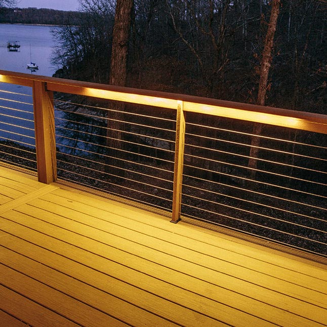MoistureShield composite deck and composite deck railing with rail lighting.