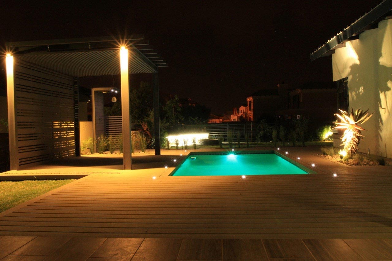 Illuminated pool and decking at night