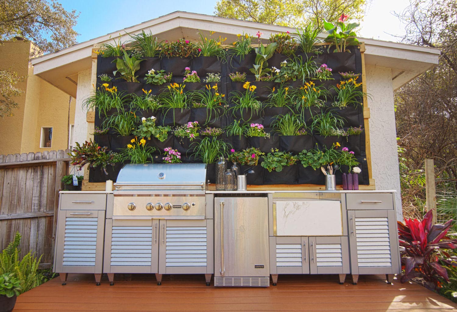 Outdoor grill with deck and hanging flowers