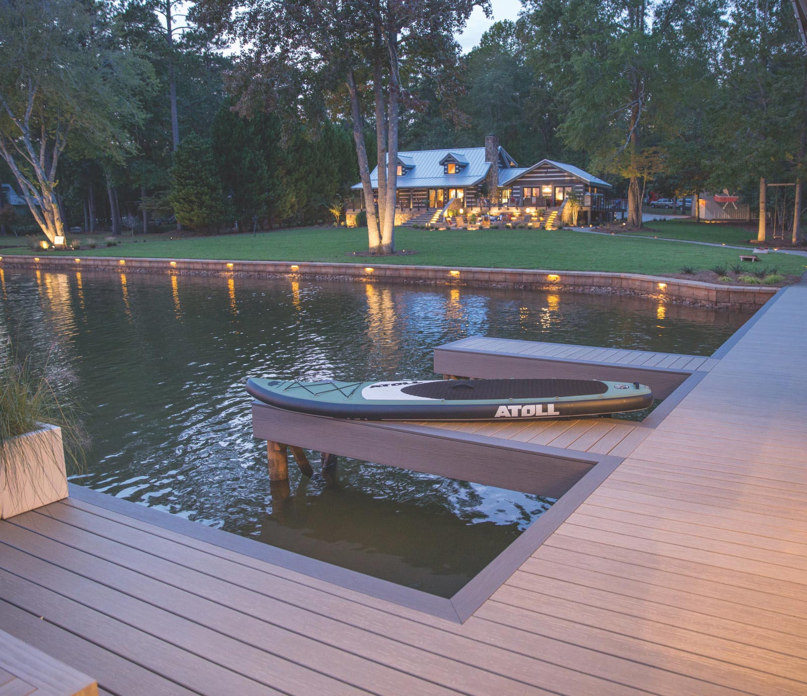 Dock with bodyboard, cabin in background