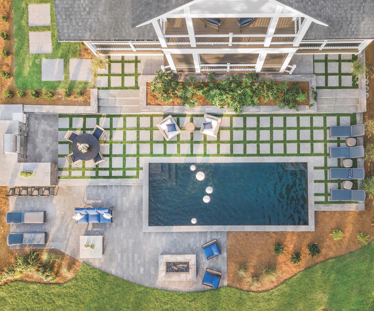 Overhead view of composite decks and a paver patio.