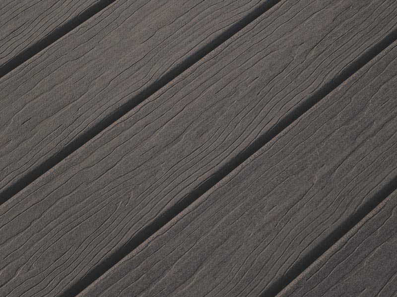 Close view of dark gray MoistureShield composite decking boards.