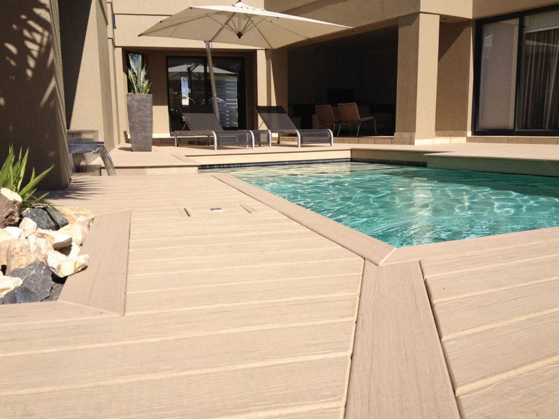 MoistureShield composite decking pool deck with built-in planter.