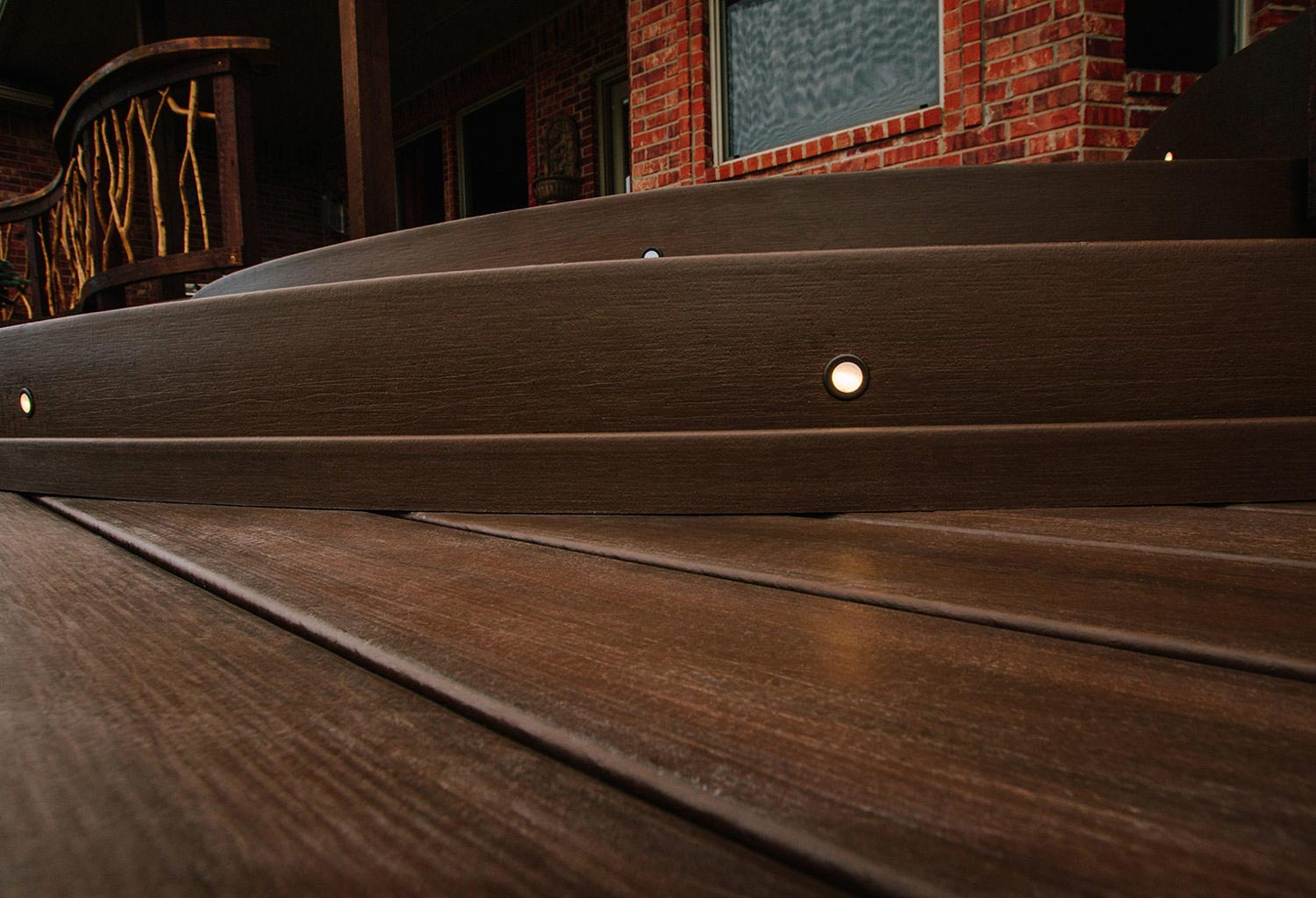 Close view of composite stairs with inset lighting.