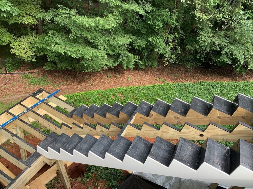 Overhead view of deck and deck stairway substructure with joist tape applied.